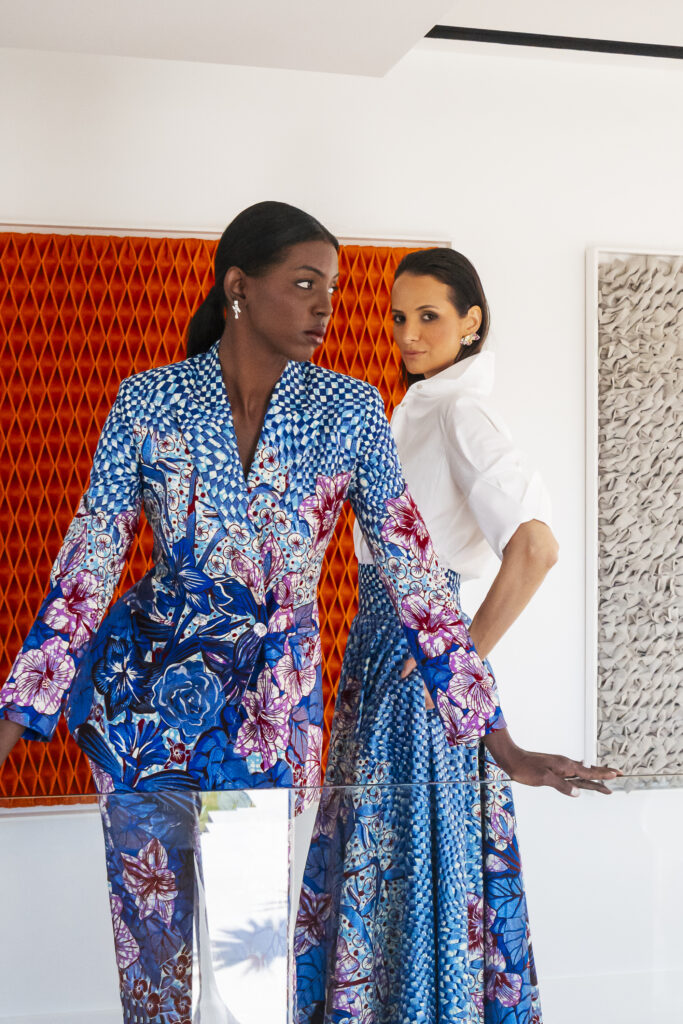 A Decade of Design: Roselyn Silva on Intentional Elegance and Her São Tomé Roots 1 Two women in blue printed looks from Roselyn Silva's spring summer 2025 Legacy collection