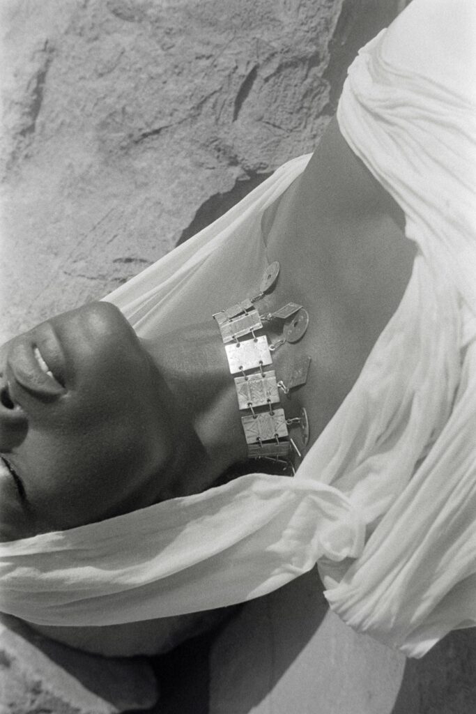 The Safaah choker by FAD and INDIGENIUS, a wide banded collar worn against a white draped garment