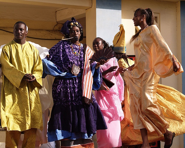 Contemporary photograph by Tj Haslam showing a man in a traditional agbada at a family or community celebration.