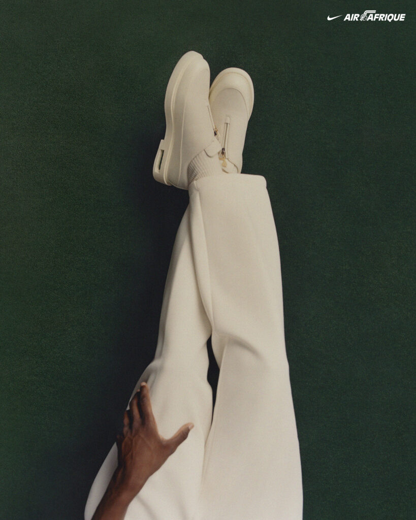 White shoes and pants against green