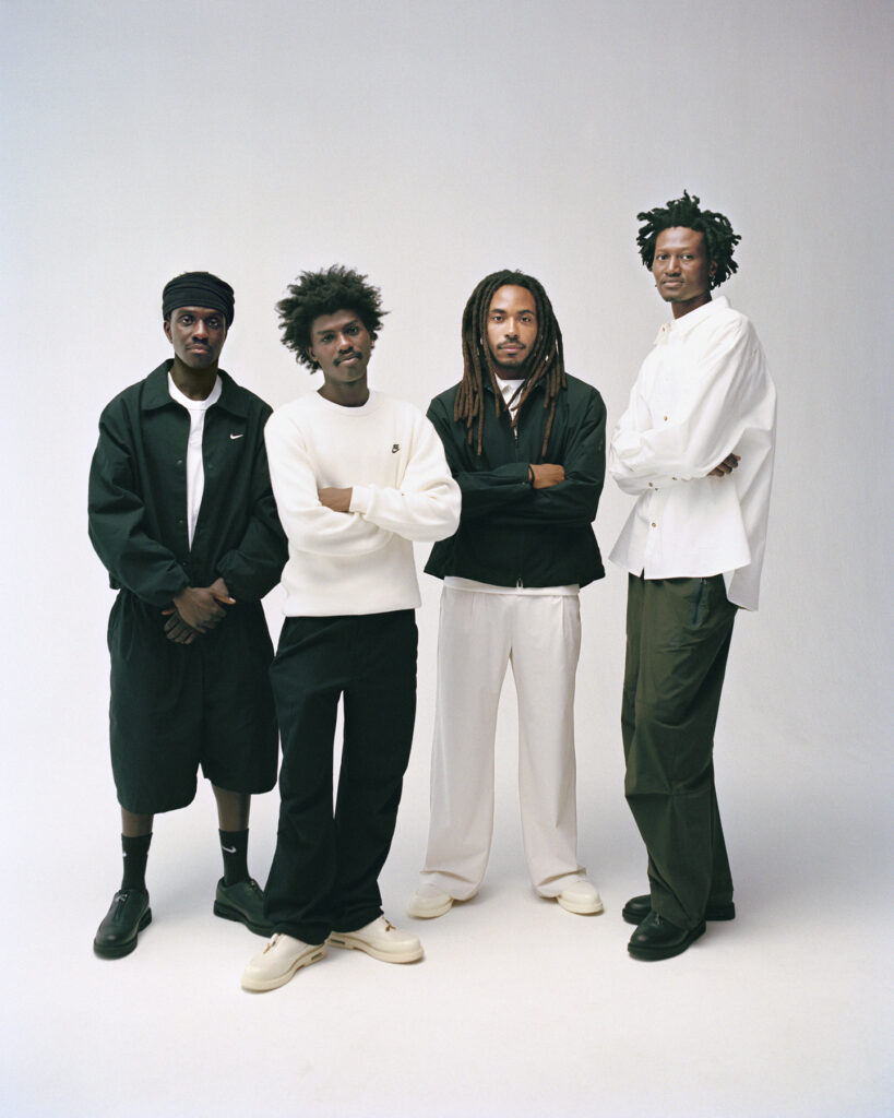 Four stylish individuals in casual attire.