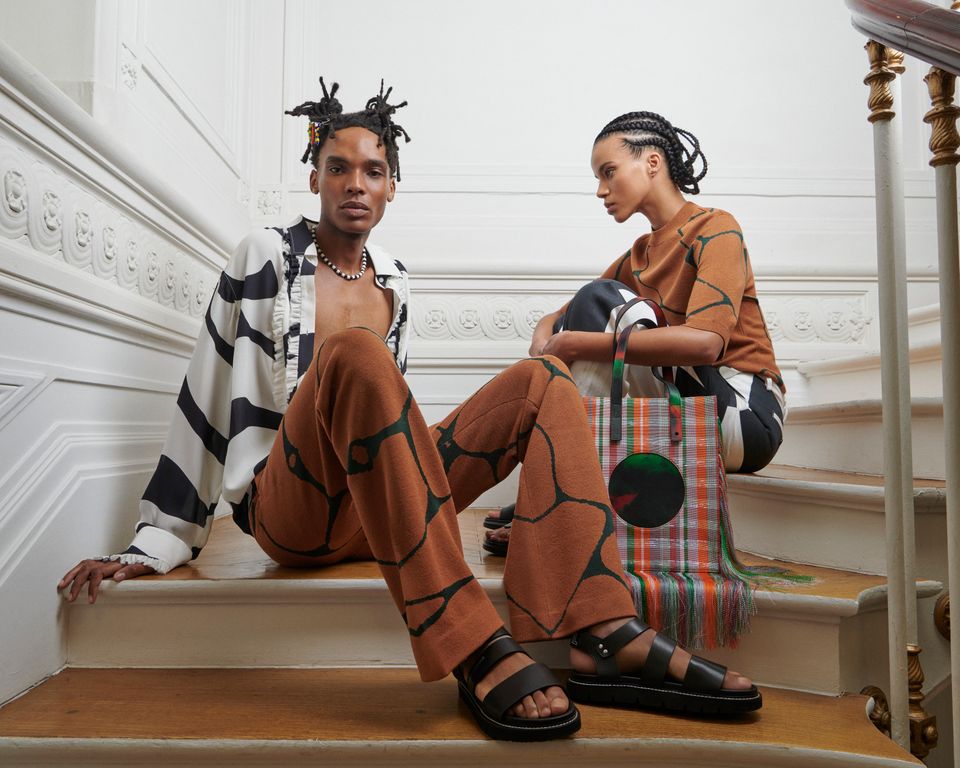 Stylish individuals on staircase, fashion.