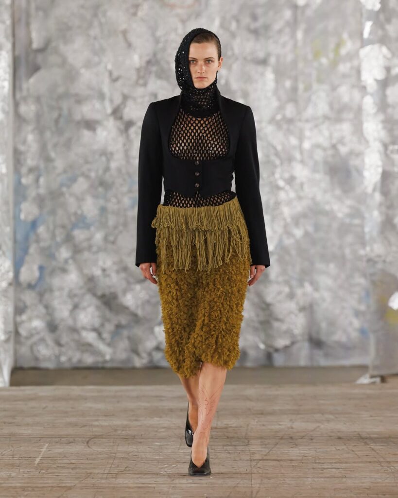 Model in unique fashion ensemble.