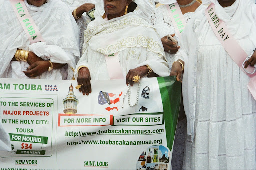 Women in white promoting Touba USA