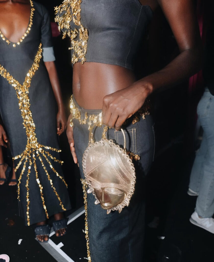 African Ritual Aesthetics in the Age of Luxury Fashion 2 Detail of cowrie shell and metal body jewellery from Adama Paris's Waridje collection at Lagos Fashion Week 2023