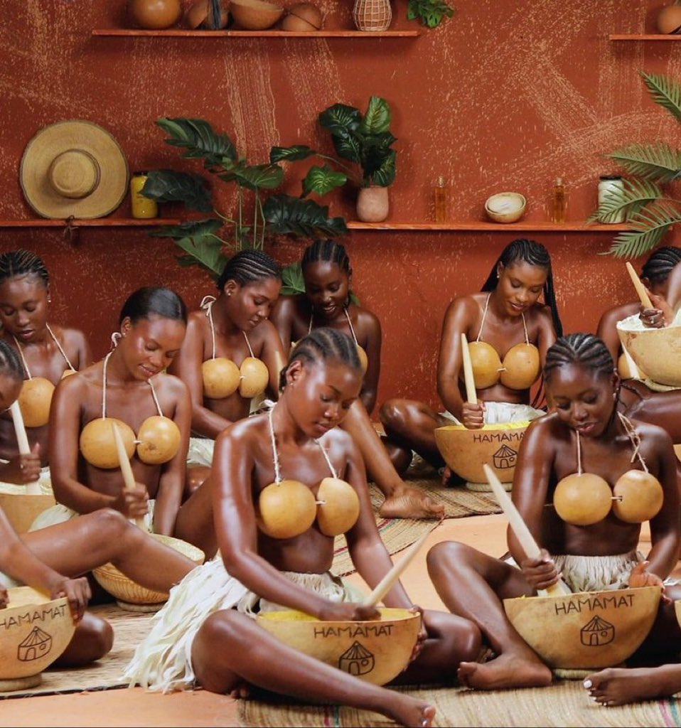 Hamamat and local women performing a traditional shea butter massage and Dagbani chant at the Shea Butter Museum in Ghana.