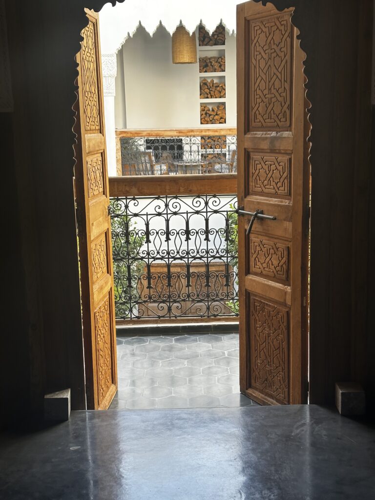 The Best Places to Propose in Africa: From Cape Town to Marrakech 6 Carved wooden doors opening onto the tiled courtyard of a riad in Marrakech