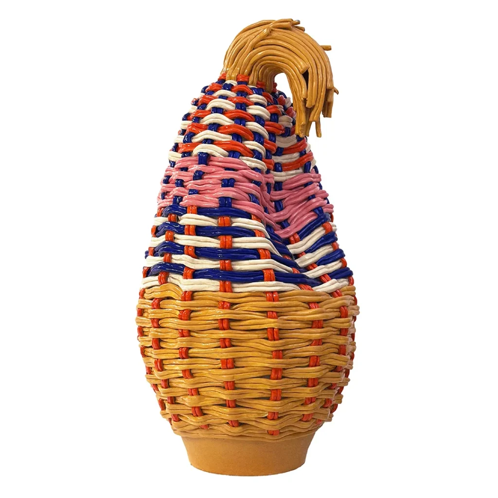 Three African Knowledge Systems on the Loewe Craft Prize 2026 Shortlist 44 A contemporary ceramic sculpture by Xanthe Somers for the Loewe Craft Prize, shaped like a tall woven basket or vase with a textured, colorful surface in shades of orange, yellow, and violet