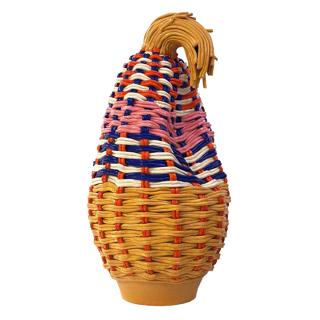 A contemporary ceramic sculpture by Xanthe Somers for the Loewe Craft Prize, shaped like a tall woven basket or vase with a textured, colorful surface in shades of orange, yellow, and violet