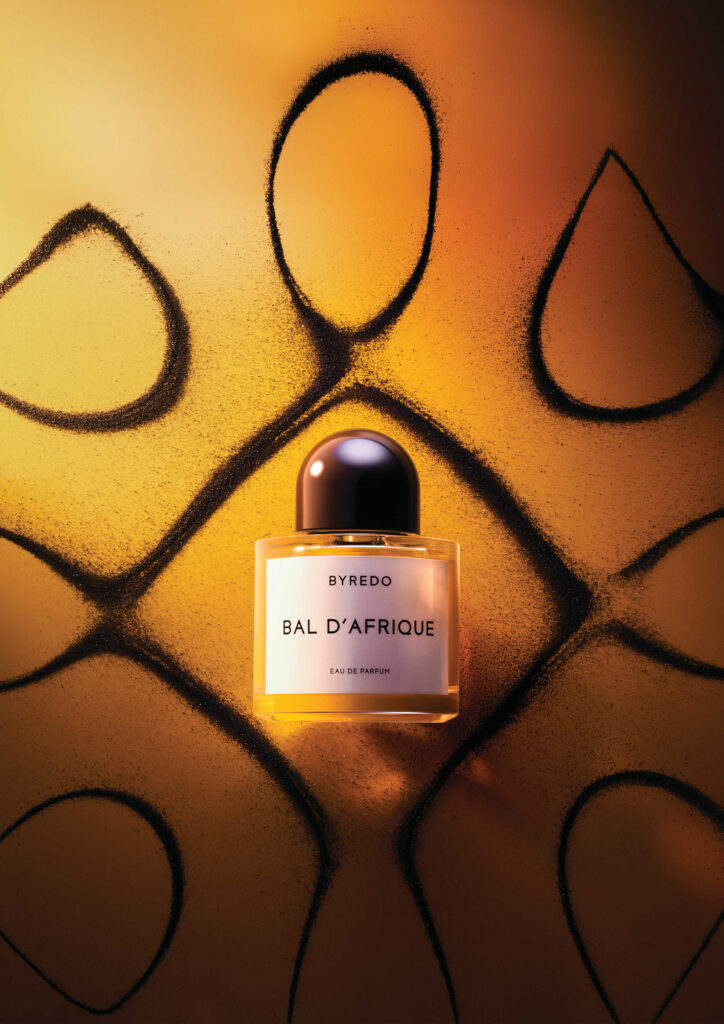 Close-up of the new Byredo Bal d'Afrique Absolu de Parfum bottle featuring the Yakisugi-inspired charred wood cap, photography by Romain Lenancker.