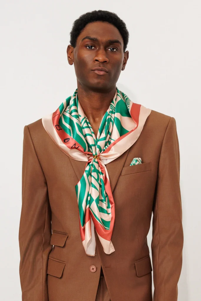 Kibonen and the Business of Cultural Authority 4 Man in stylish brown suit and scarf