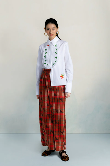 Amayi Archive One: structured cream ribbed sleeveless top paired with red plaid maxi skirt, Southern African blanket textile reference