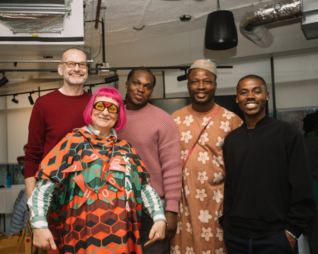 Inside Central Saint Martins’ Makers Camp: West African Makers in Focus 7 A group portrait of West African visiting designers and Central Saint Martins tutors, including Berni Yates, Ugonna-Ora Owoh, Peter Acha, and Travis Obeng-Casper, standing together in a studio during the Makers Camp.