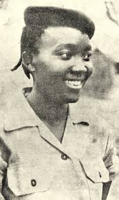 The Women Who Built the Revolution 5 Black and white historical photograph of Josina Machel in a military uniform, a symbol of her leadership as a revolutionary fighter and advocate for women’s rights in Mozambique.