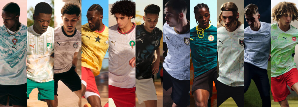 A diverse group of models standing together outdoors, each wearing a different national team jersey from PUMA's 2026 World Cup away collection