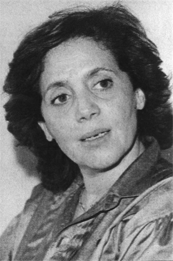 The Women Who Built the Revolution 4 Black and white archival portrait of Djamila Bouhired, an iconic leader of the Algerian Revolution, looking upward with a neutral and resolute expression.