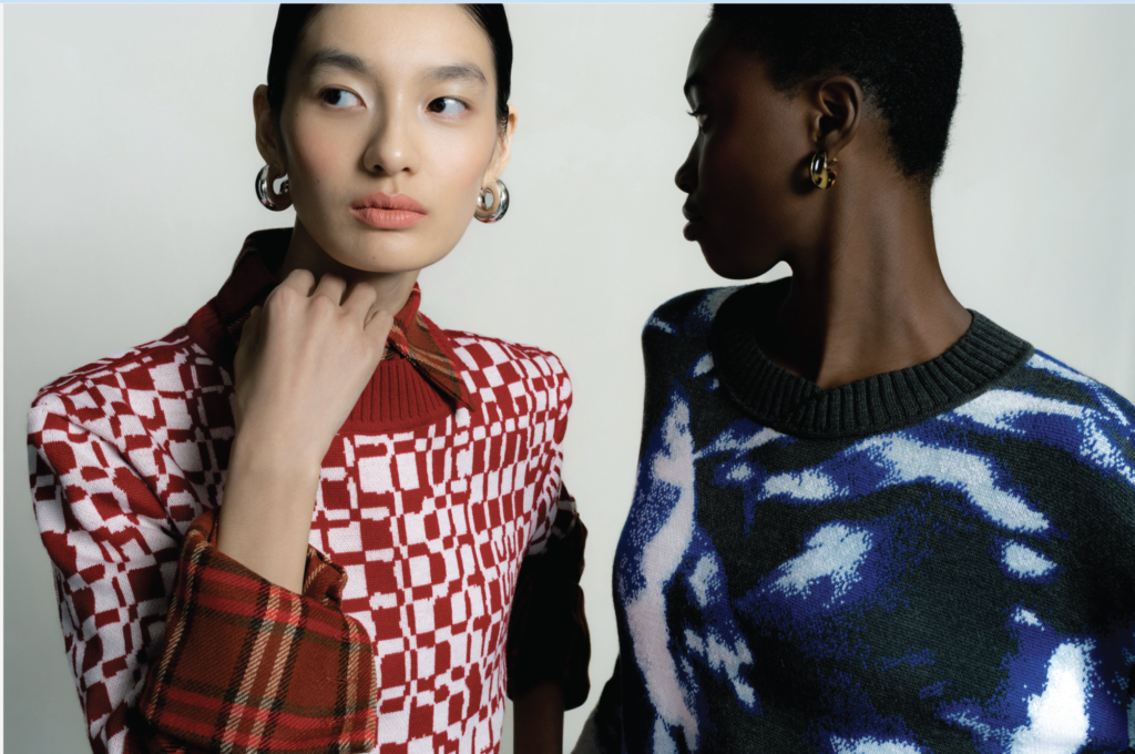 Amayi Archive One: two models in checkered knit jackets, red and white geometric pattern with blue abstract sweater, Archive One knitwear