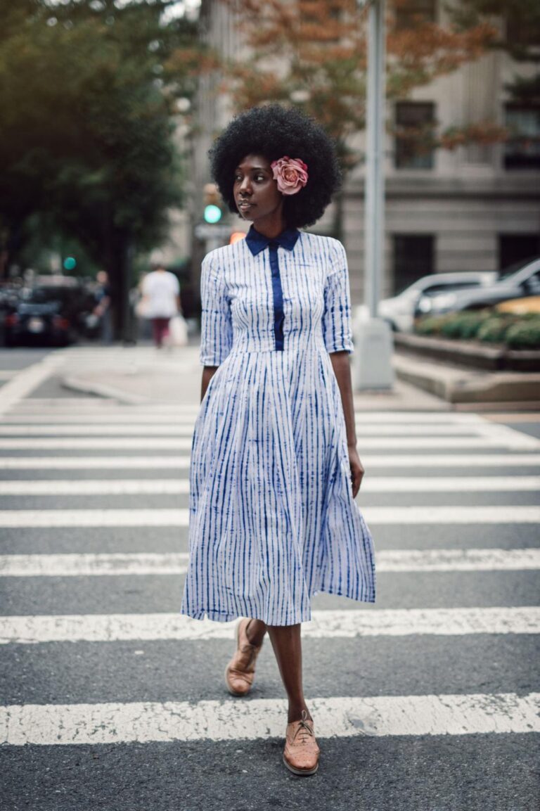 Mariama Camara wearing Guinean indigo tie-dye dress crossing a New York City street
