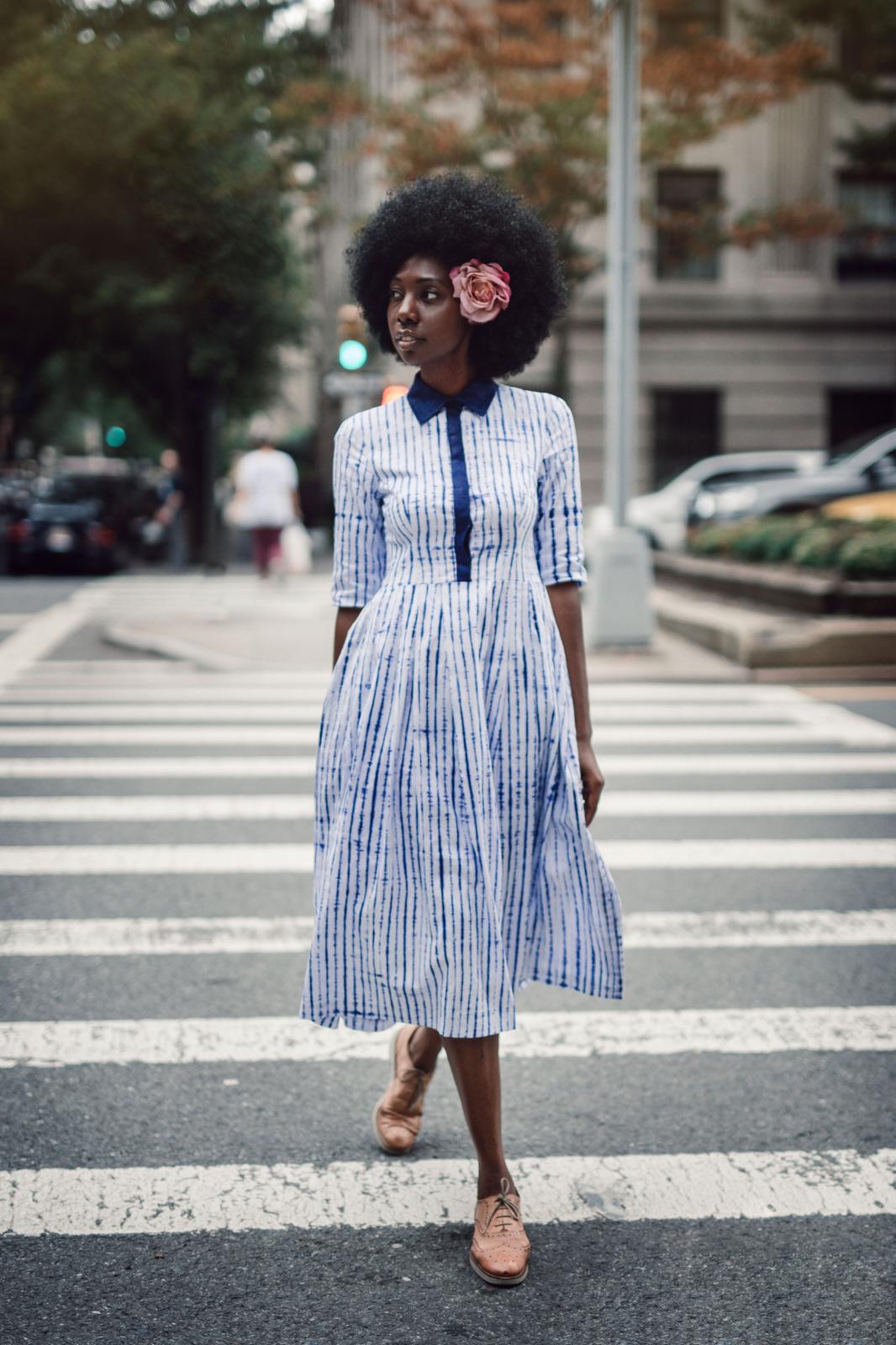Material Literacy 5 Mariama Camara wearing Guinean indigo tie-dye dress crossing a New York City street