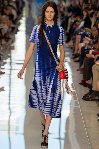 Material Literacy: The Knowledge in Cloth 4 A model on the runway wearing a blue and white Guinean indigo tie-dye dress from the Tory Burch collaboration by Mariama Camara.