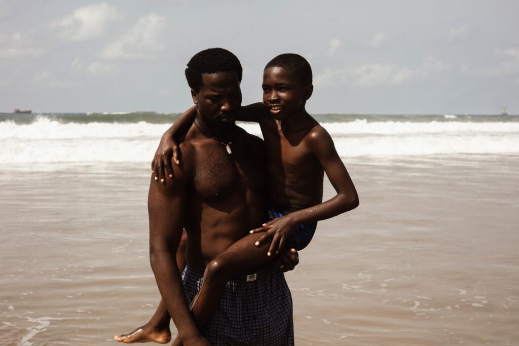 An evocative scene from Akinola Davies Jr.’s My Father’s Shadow, illustrating the unique texture and color of shooting on 16mm film in Lagos.