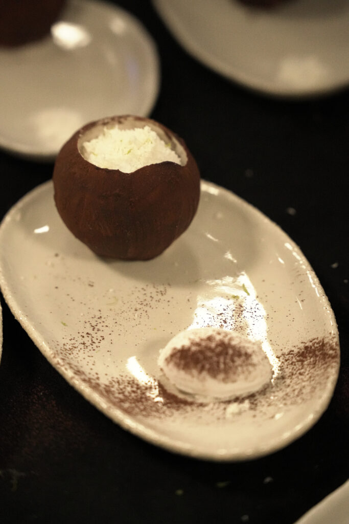 Kondokpo: Georgiana Viou and Nokx Majozi at Sofitel Cotonou 5 Le Trou Béninois dessert, featuring a lemon-ginger sorbet beautifully presented on a white plate during the Kondokpo event.