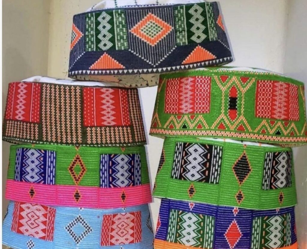 Close-up of a traditional Pouto cap, a handwoven and geometrically embroidered Fulani textile from Guinea used historically to indicate social status.