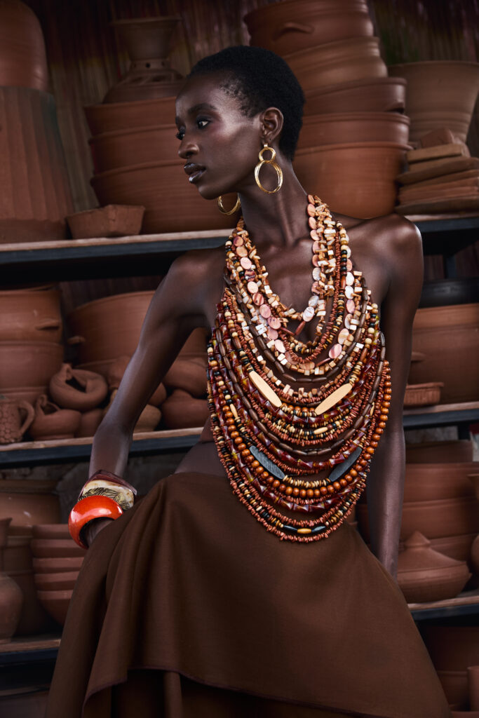 Hertunba's 'Akaoru' Collection Is a Lesson in What Craftsmanship Actually Costs 5 Hertunba garment featuring artisan-crafted clay beads integrated seamlessly within a working Nigerian pottery studio.