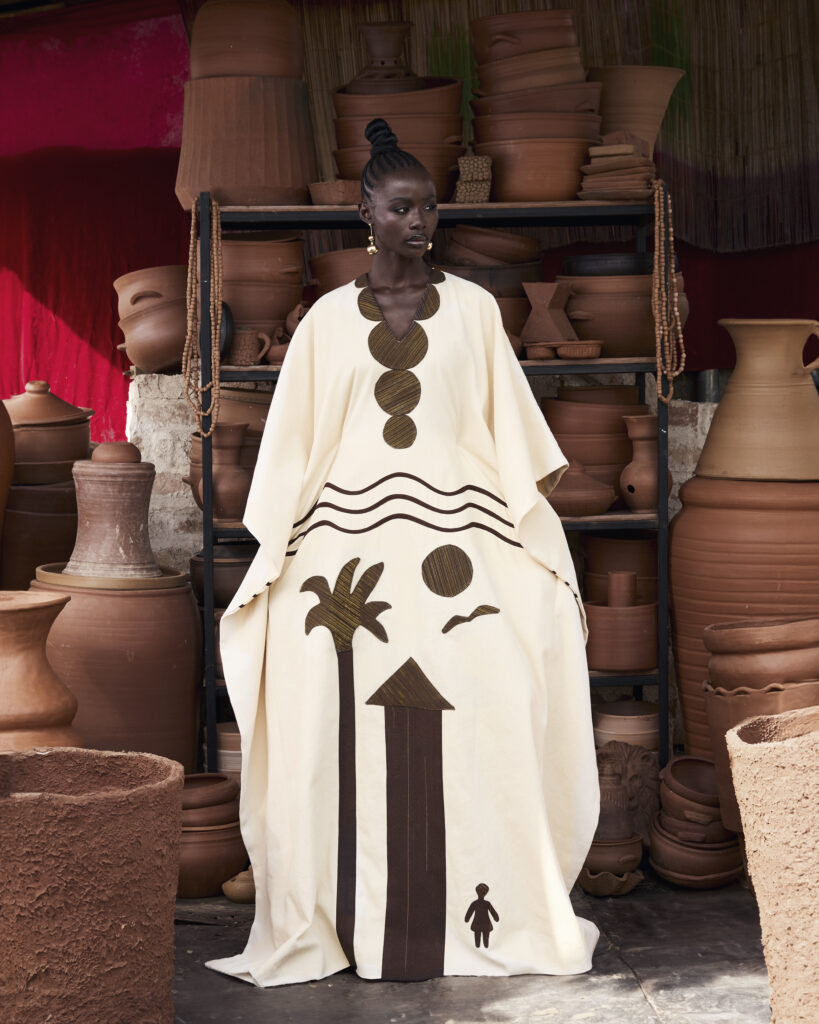 Hertunba's 'Akaoru' Collection Is a Lesson in What Craftsmanship Actually Costs 6 Hertunba Akaoru garments featuring hand-applied landscape compositions, appliqué, and embroidered motifs of palm trees and dwellings.