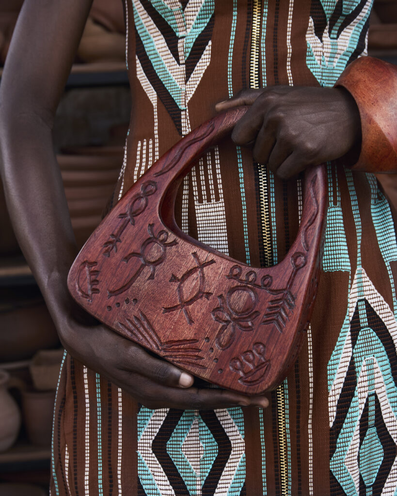 Hertunba's 'Akaoru' Collection Is a Lesson in What Craftsmanship Actually Costs 3 Handcrafted carved wooden bags and one-of-a-kind bangles made from reclaimed mahogany and ebony by Nigerian artisans for Hertunba.