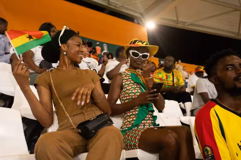 African football fans wave a Ghana flag in the stadium stands at AFCON 2025, photographed ahead of the 2026 World Cup.