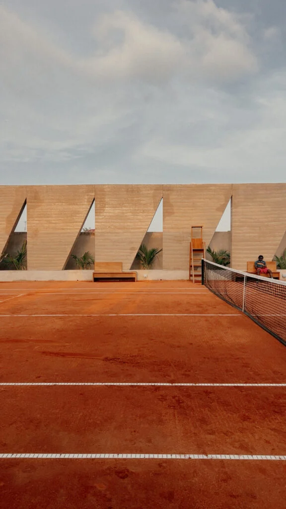 Architecture Learns to Play 23 Backyard Community Club in Osu, Accra: rammed-earth tennis enclosure by DeRoche Projects