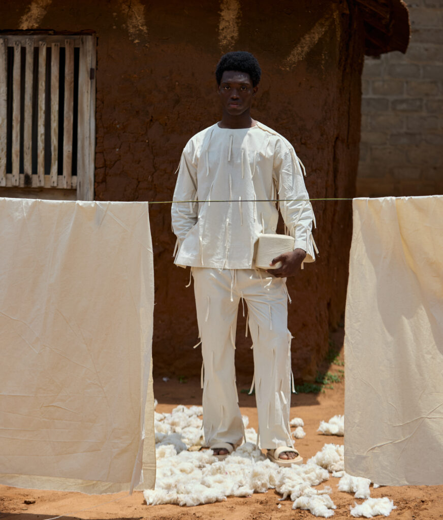 At BAKUS ORAYA, Cotton in Its Final State 8 Look 05 — White Tank in Sequins, Black Wide-Leg.