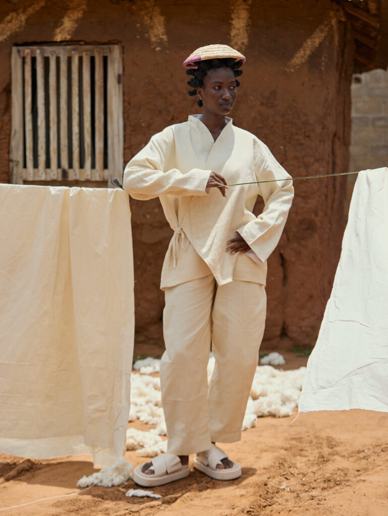 At BAKUS ORAYA, Cotton in Its Final State 4 Look 01 — Fringed Tweed Jacket, Tailored Trousers.