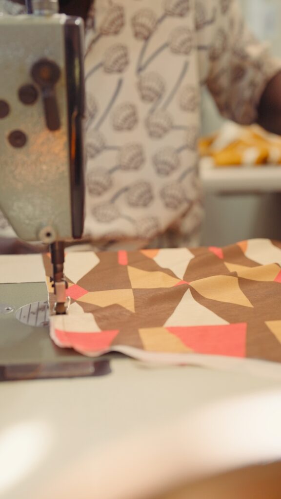 Diarra Bousso Builds Fashion From Mathematics, Technology, and Craft 2 A Diarrablu artisan sews hand-finished textiles in the Dakar atelier, Spring 2026 collection