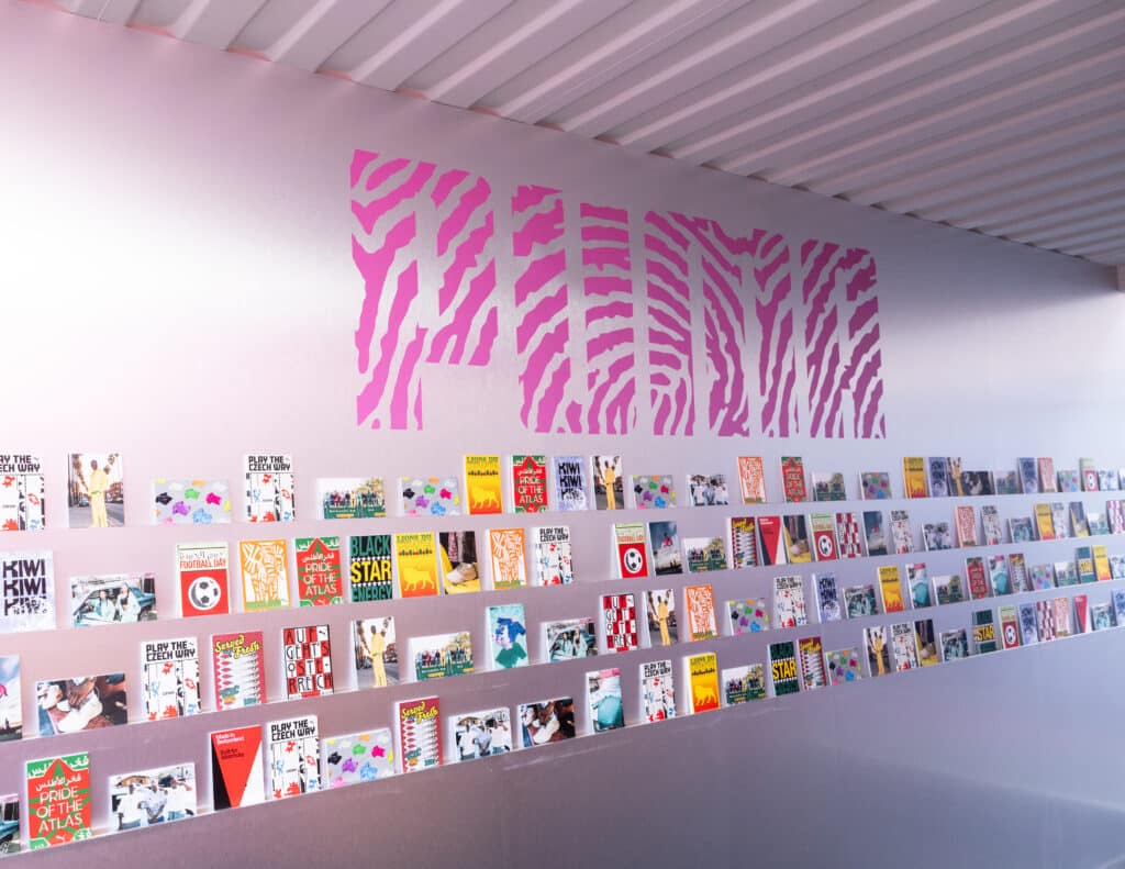 Puma Brought the Continent to Downtown LA. The Postcards Were the Tell 6 Wall of African World Cup postcards at Puma's Salehe Bembury activation at The Row DTLA