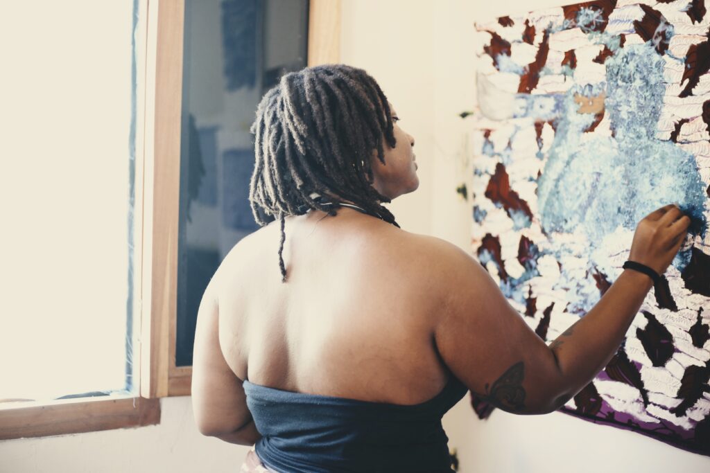 Ewuresi Archer painting in her studio