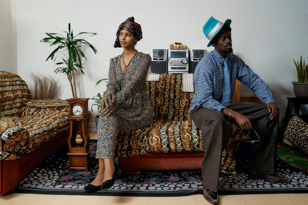Eugénie and François Odouffan and a younger couple in the living-room set of Michel Odouffan’s Generational Love