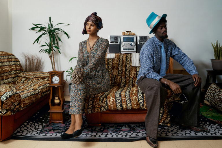Eugénie and François Odouffan and a younger couple in the living-room set of Michel Odouffan’s Generational Love
