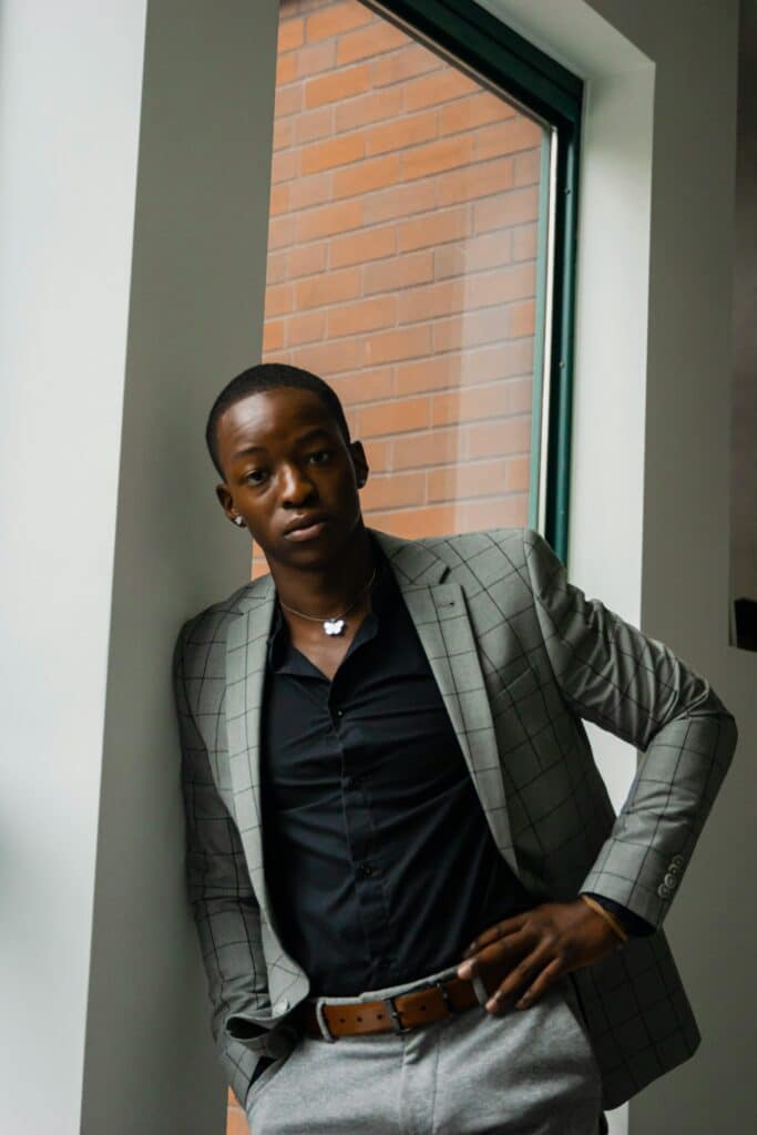 A thoughtful young African man photographed in soft natural light, illustrating a story on how African men are rethinking marriage, masculinity, and adulthood.