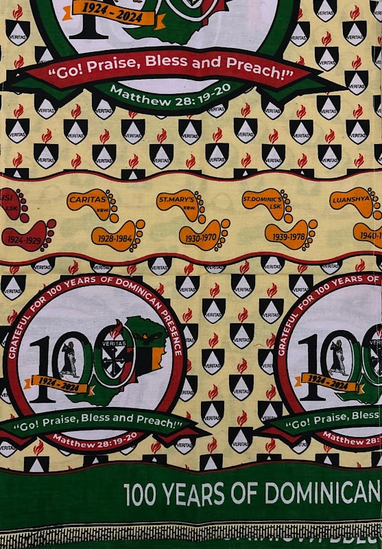 Commemorative chitenge marking a century of Dominican presence in Zambia from 1924 to 2024, with mission stations printed as footprints