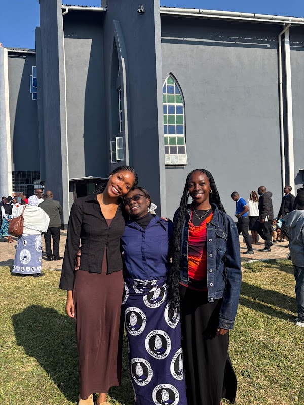 Writer Kunda Nampasa with her grandmother and sister after Mass at Chelstone Catholic Church, Lusaka