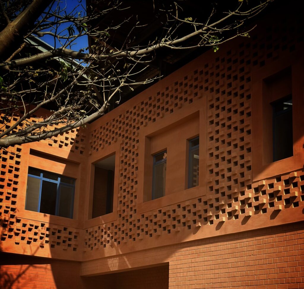 Laterite brick façade of the Goethe-Institut Dakar with perforated openings for airflow
