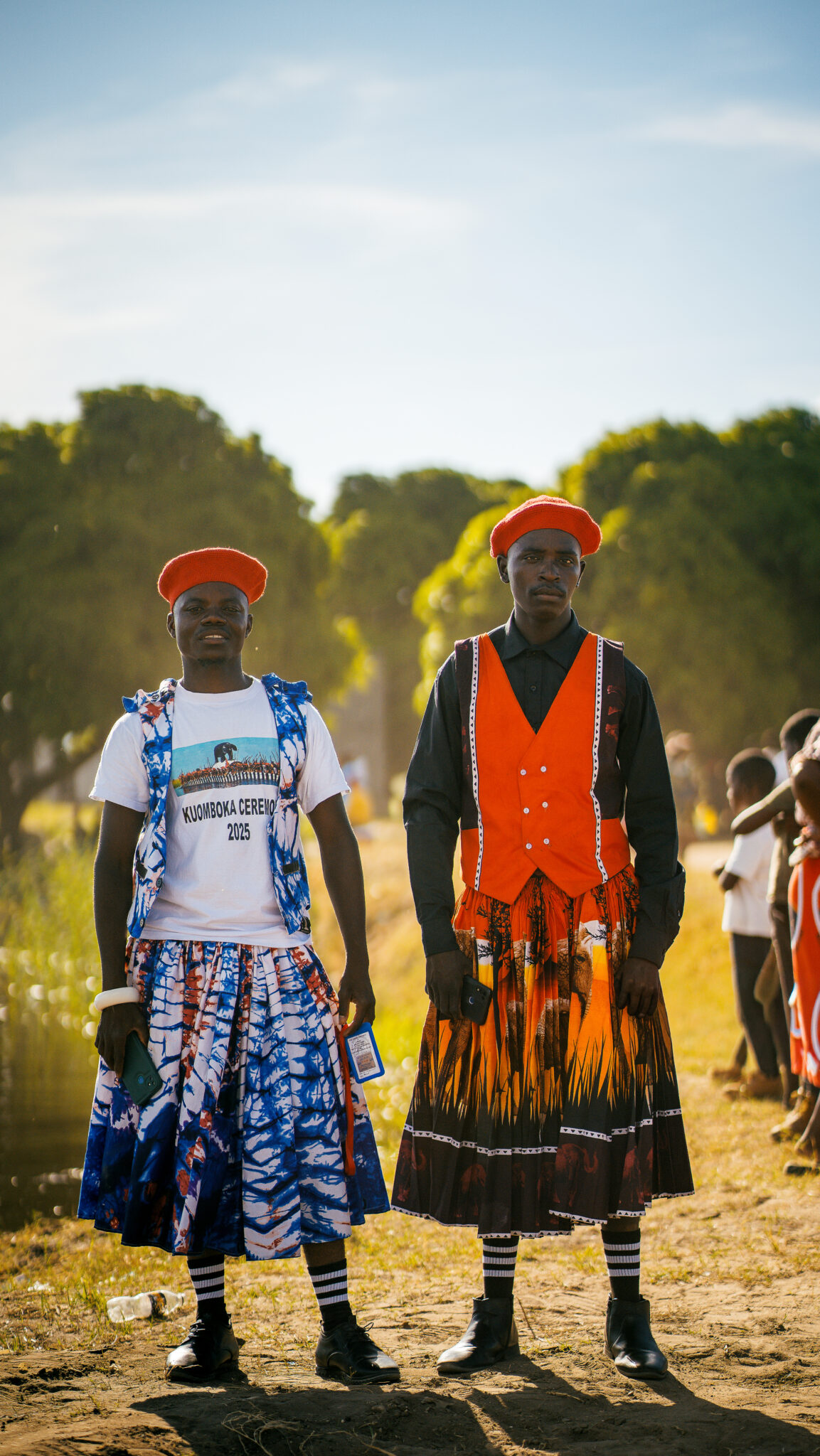 Six Days on the Zambezi: A Traveller's Guide to Kuomboka 10 Two Malozi men in red berets and traditional Lozi wrap skirts at Mongu, Zambia, during the Kuomboka ceremony that marked the Litunga's Silver Jubilee.
