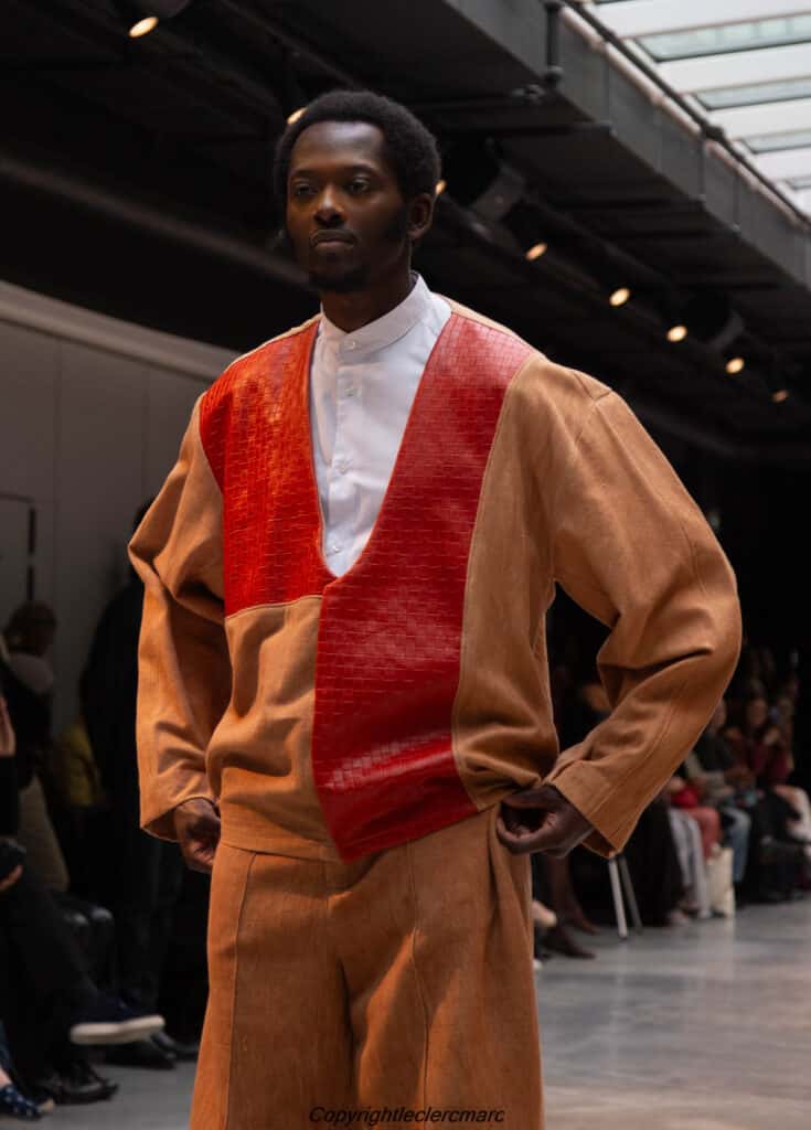 Model in a camel top with a rust colour-blocked panel, NAANIYA SS26 Tombouctou collection at Paris Fashion Week