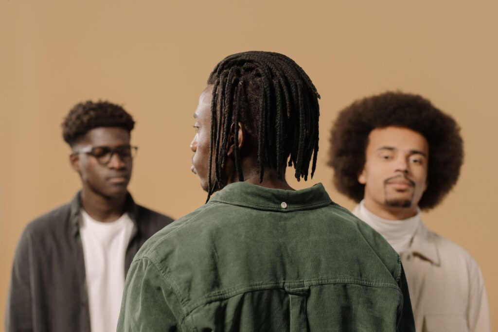 The Burden of Silence: Why African Men Struggle to Talk About Mental Health 3 A man alone in shadow, his face partly turned away, suggesting isolation and silence.