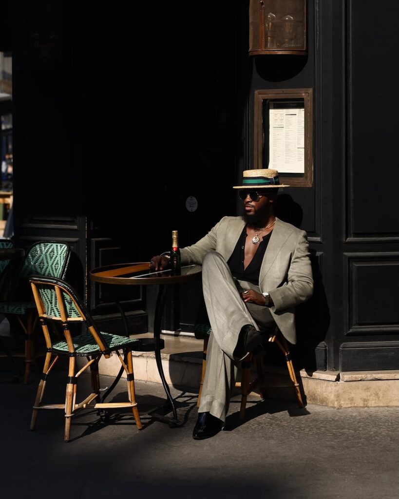 Akin Faminu on Style, Taste and the Things He Returns To 4 Akin Faminu seated in an Emmy Kasbit suit during Paris Fashion Week