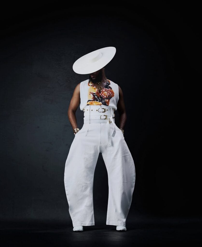 Akin Faminu on Style, Taste and the Things He Returns To 3 Akin Faminu in a white Orange Culture Spring 2026 outfit with a wide-brim hat