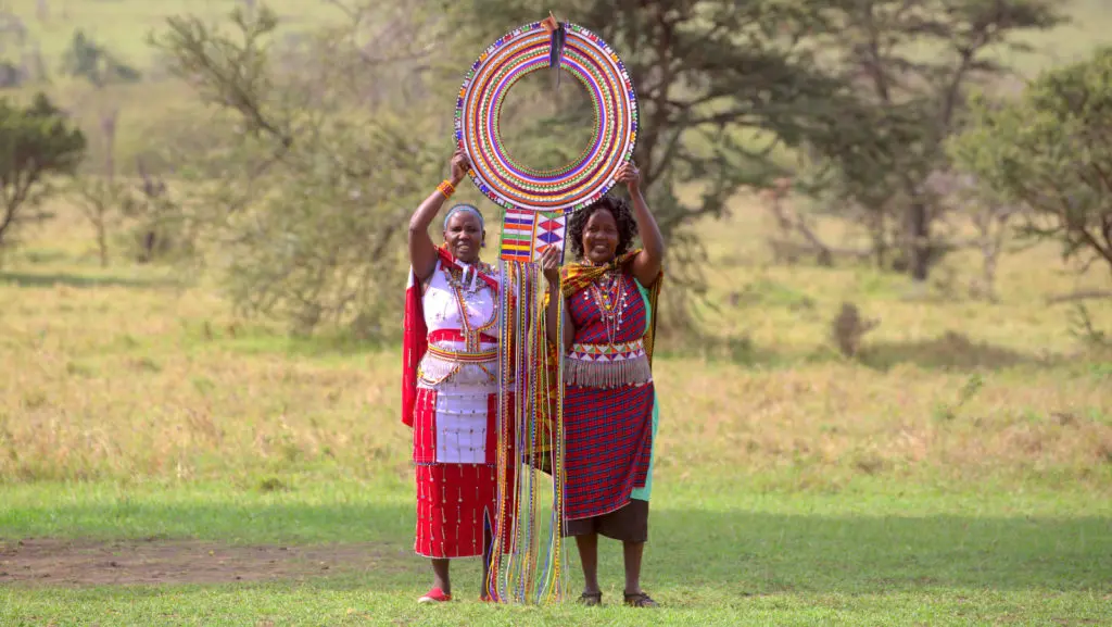 Noormesuku Kereto with the Enkarewa, the wide beaded Maasai collar she spent more than two months making, at Naboisho Camp in the Maasai Mara, 2019