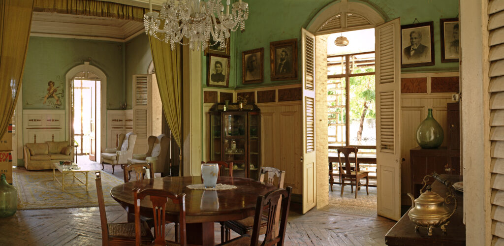 Ornately carved woodwork and high ceilings in the Gingerbread-style interior of Villa Miramar